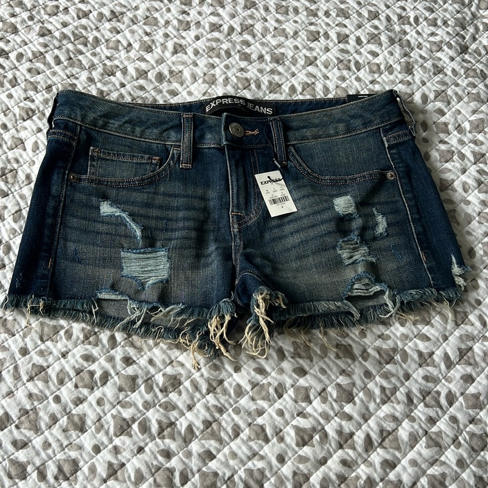 Low rise denim cutoff shorts. Express Shortie- Size 4. Never worn. Soft material